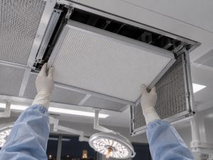 Fitting HEPA panel into ceiling housing